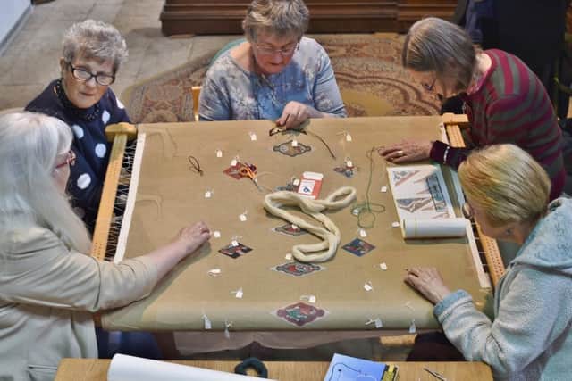 The Peterborough Embroiders Guild starting their tapestry of the Peterborough Cathedral ceiling. EMN-180606-174424009