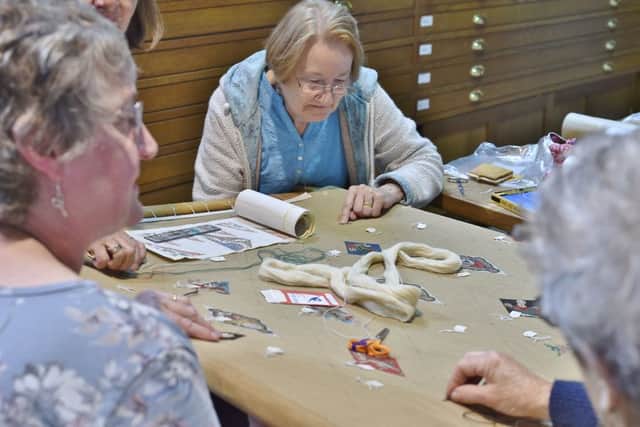 The Peterborough Embroiders Guild starting their tapestry of the Peterborough Cathedral  ceiling. EMN-180606-174457009
