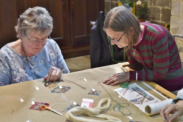 The Peterborough Embroiders Guild starting their tapestry of the Peterborough Cathedral  ceiling. EMN-180606-174508009