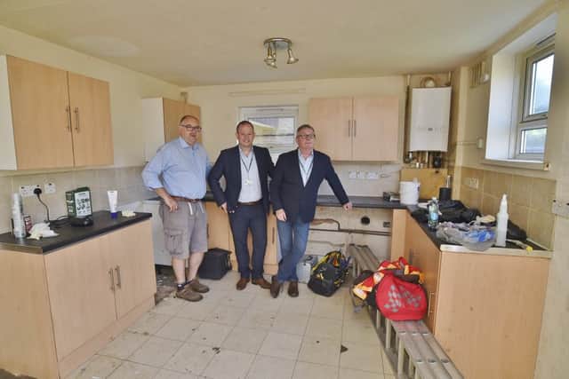 Adam Cliff, PCC Operations (centre), Dr Alan Graham, the Buy to let Doctors (left) and Coun Peter Hiller at a property in Wildlake, Orton Malborne due for occupation by the homeless. EMN-180613-132354009