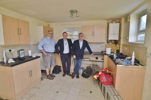 Adam Cliff, PCC Operations (centre), Dr Alan Graham, the Buy to let Doctors (left)  and Coun Peter Hiller at a property in Wildlake, Orton Malborne due for occupation by the homeless. EMN-180613-132354009