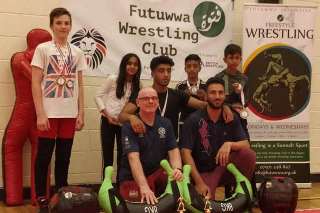 The Futuwwa team that did well at the English Junior Championships. They are from the left, back, Jimmy Borowski, Habibah Fatimah Zahrah Nargis, Muhammad Abdullah Hussain, Abdur Rahman Sajid, Zain al Abideen Zahid, front, Trevor Hoskins (coach) and Asif Ali (coach).