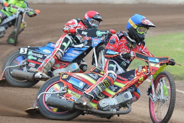 Heat three action from Peterborough Panthers' win over Ipswich involving Michael Palm Toft (blue helmet) and Bradley Wilson-Dean (red). Photo; David Lowndes.