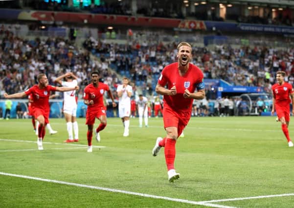 England captain Harry Kane celebrates against Tunisia.