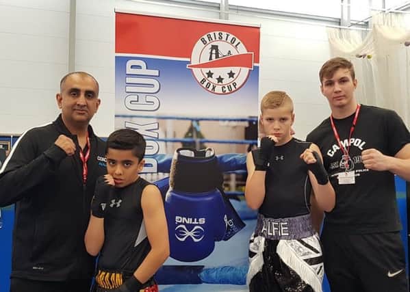 The Peterborough Police Amateur Boxing Club team at the Bristol Cup. From the left are coach Akif Shirazi, Imraan Shirazi, Alfie Baker and  coach Artur Tomasevic