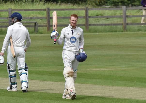 Michael Hobbiss celebrates his brilliant 166 for Burghley Park against Houghton & Wyton. Photo: J Biggs Photography.