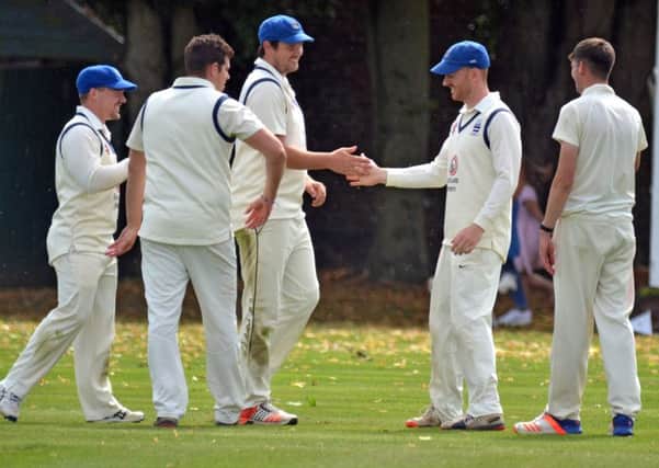 Colin Cheer (third left) bagged a hat-trick in a spell of 5-47 for Bourne against Alford.