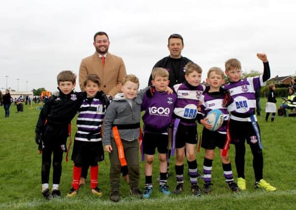 Will Wallace from Larkfleet Homes and Richard Olsen from Stamford Under 7  with some of the youngsters who will benefit from the grant from the Larkfleet Homes Community Fund.