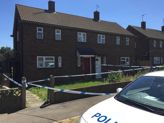 The police cordon remains in place in Viney Close in Peterborough.