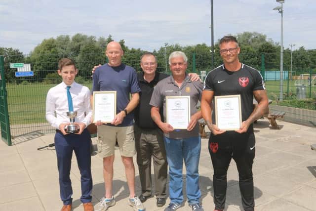 Ben Lilley (left), winner of the PDFL Young Referee of the season award, is pictured with Robert Windle (centre) and  representatives from Whittlesey Athletic, Stamford Belevdere and FC Parson Drove. Picture: RWT Photography