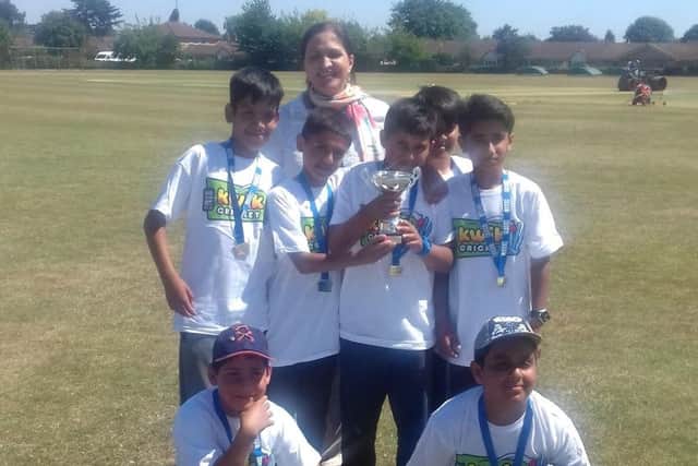 The county champions from Beeches School with cricket coach Miss Choudary,