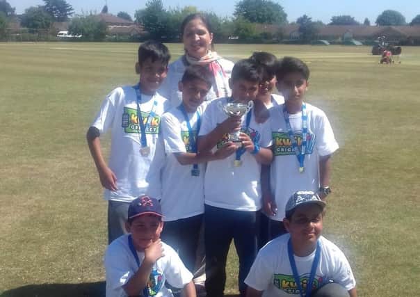The county champions from Beeches School with cricket coach Miss Choudary,
