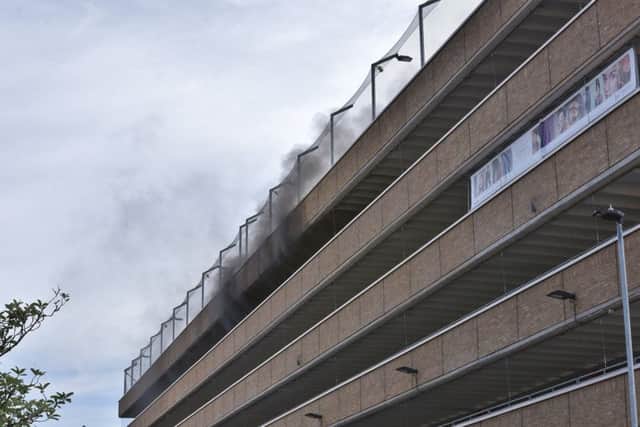 Car fire on one of the top floors at Queensgate car park. EMN-180107-222331009