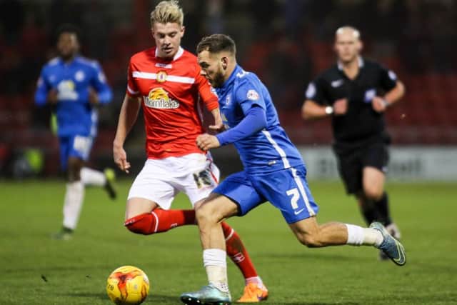 Adam King (left) in action for Crewe against Posh. Photo: Joe Dent/theposh.com.