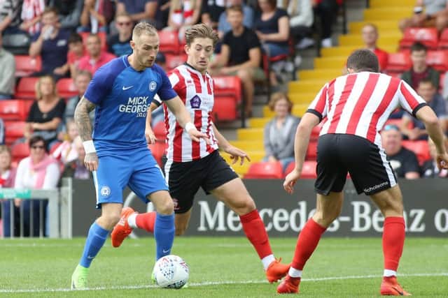 Alex Woodyard (centre) could be next season's Posh skipper.