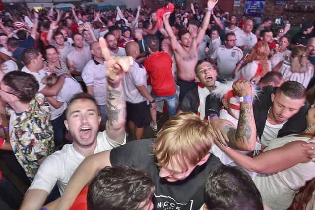 England fans at the XL Arena celebrate as England win on penalties
