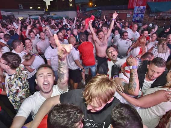England fans at the XL Arena celebrate as England win on penalties