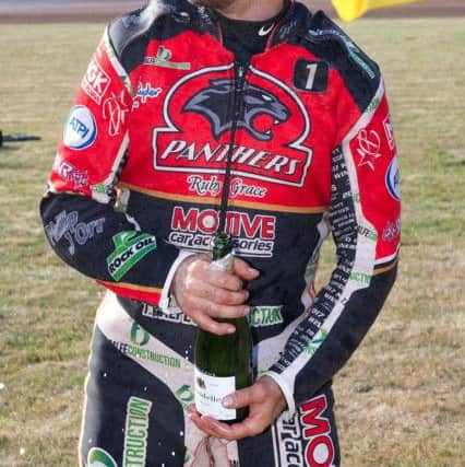 Scott Nicholls enjoys a champagne moment. Picture: Colin Poole