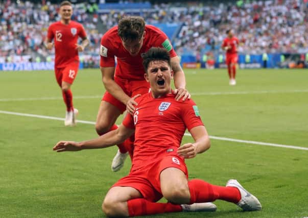 Harry Maguire celebrates his goal for England against Sweden.