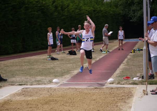 Max Roe in the long jump event at Ipswich.