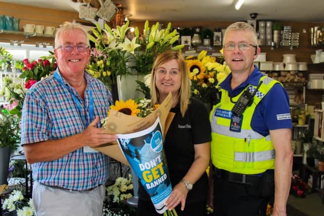From left, Steve Jackson; Stephanie Romaine of Stephanies Flowers; and PCSO Graeme Parrott.