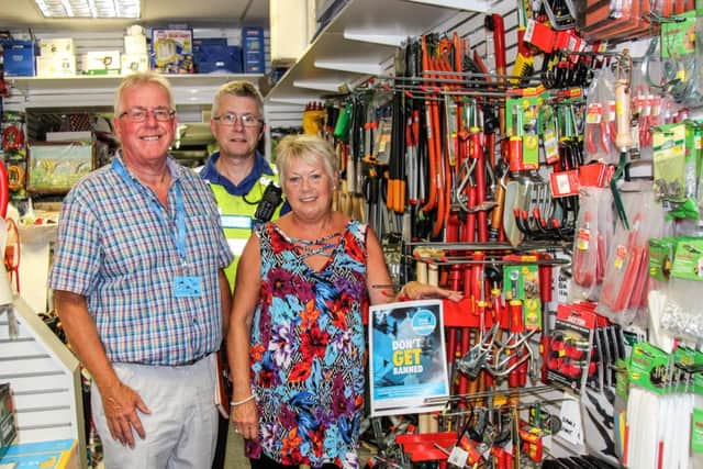 From left, Steve Jackson; PCSO Graeme Parrott; and Val Coddington, of Harrison and Dunn hardware shop.