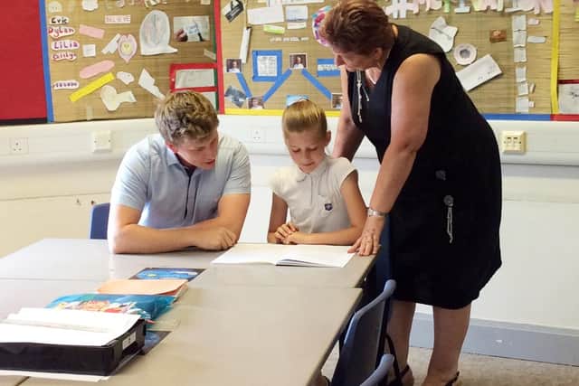 Headteacher Tracey Cunningham with teacher Nick Coles and student Caitlyn Scarbro at William Law Primary School in Peterborough