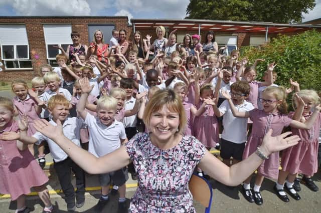 Stanground St John's primary school Key Stage 1 pupils with head teacher  Sally Williams celebrating their Good OFSTED EMN-180716-124728009