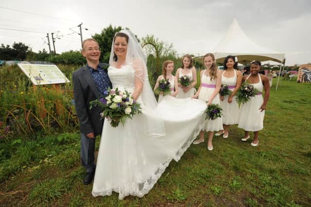 Alun Williams and Melanie Addison host their wedding reception at the Green Back Yard, where they met as volunteers. Pictured with bridesmaids Rhiannon Blackshaw, Kate Blackshaw, Emma Smolnikova, Ebony Quow, Esther Jeffers. ENGEMN00120120408203058
