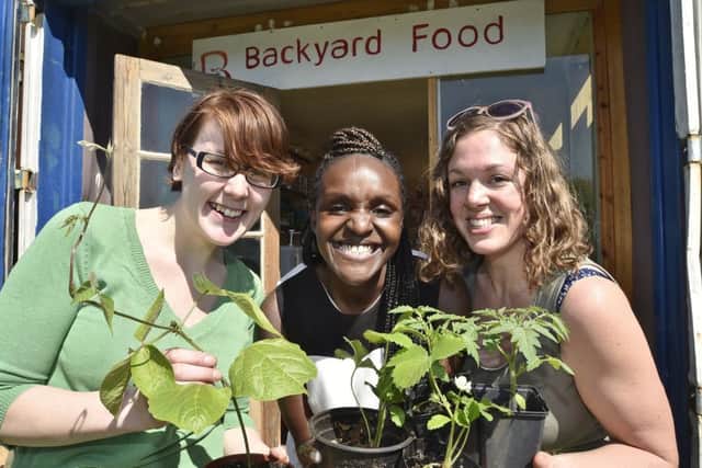 Re-launch of the new Green Back Yard produce shop -  Danette O'Hara and Sophie Antonelli with MP for Peterborough Fiona Onasanya EMN-180505-175205009