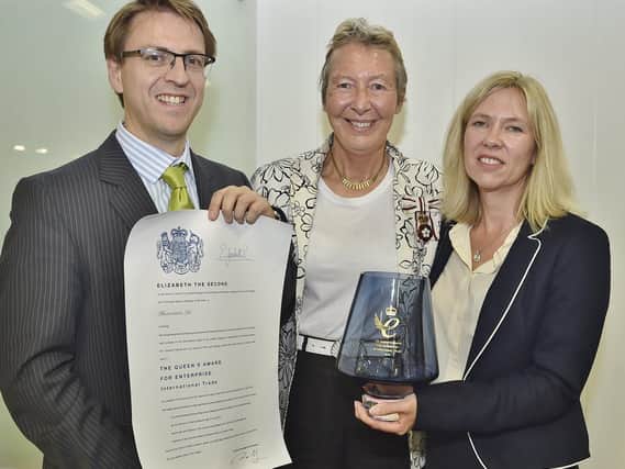 The presentation of the Queen's Award - Lord Lieutenant of Cambridgeshire Julie Spence, centre, with Tim Brown, chief operating officer of Photocentric, and Sally Tipping, sales director.