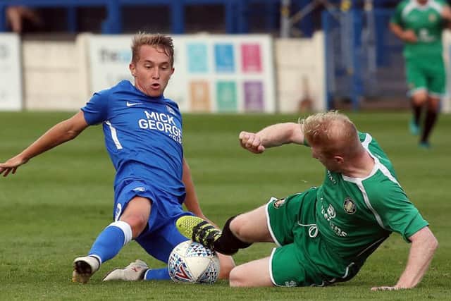Posh midfielder slides in for a tackle at Gainsborough. Photo: Joe Dent/theposh.com.