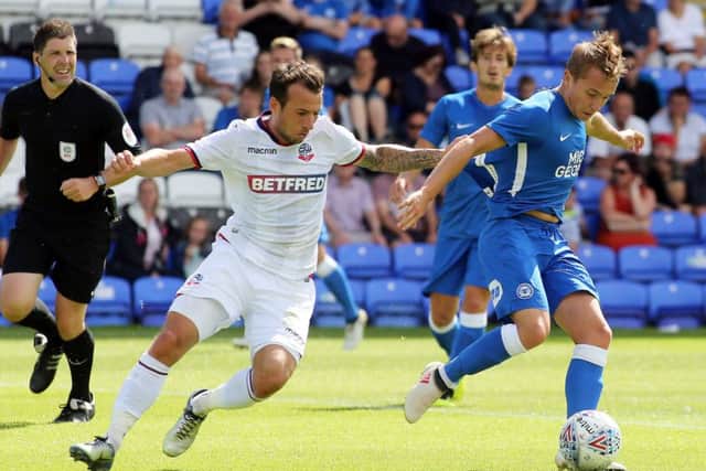 Louis Reed on the ball for Posh against Bolton. Photo: Joe Dent/theposh.com.