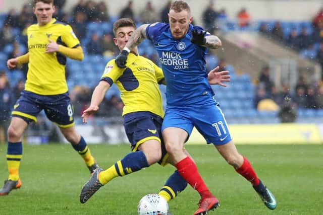 Marcus Maddison in action for Posh.
