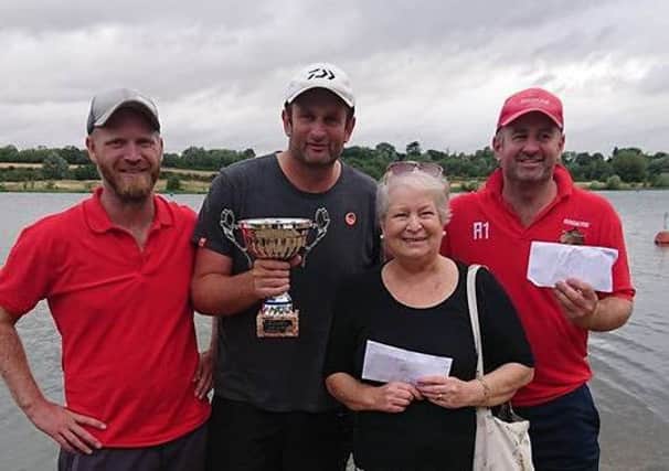 Mrs Marks pictured with the winners of the Ivan Marks Memorial match.