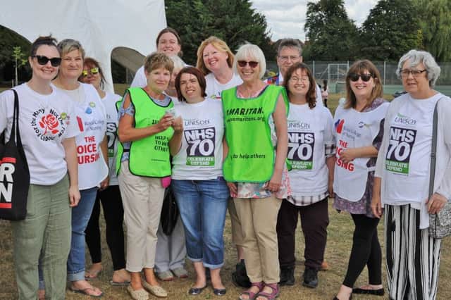 NHS 70th birthday celebrations at Central Park. Fundraising volunteers present money raised to the Samaritans. EMN-180728-174614009