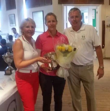 Greetham Valley ladies club champion Sophie Beardsall (centre) with club captains Sue Brand and Paul Clegg.