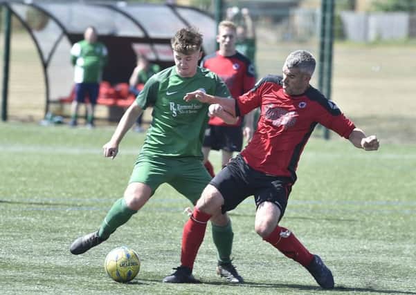 Netherton United's midfield general Mark Baines (right) in action against Biggleswade. Photo; David Lowndes.
