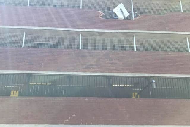 The car and the damaged wall. Photo: Matthew Canham
