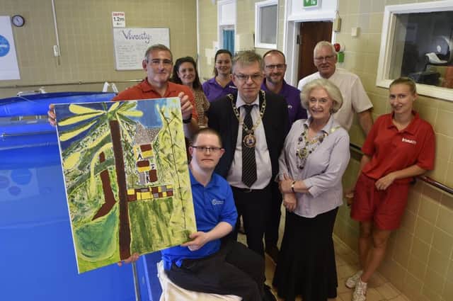 Artist Andy King with his artwork which will be displayed at St George's Hydrotherapy pool. It was unveiled by Mayor of Peterborough Coun. Chris Ash and Mayoress Doreen Roberts pictured with staff and guests at the pool. EMN-180727-161716009