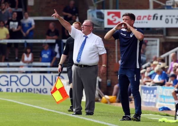 Peterborough United Manager Steve Evans issues instructions from the touchline alongside Bristol Rovers manager Darrell Clarke.  Photo: Joe Dent/theposh.com..