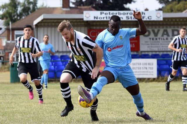 Corey Kingston (stripes) of Peterborough Northern Star in action against Rugby Town. Photo: Chantelle McDonald. @cmcdphotos.