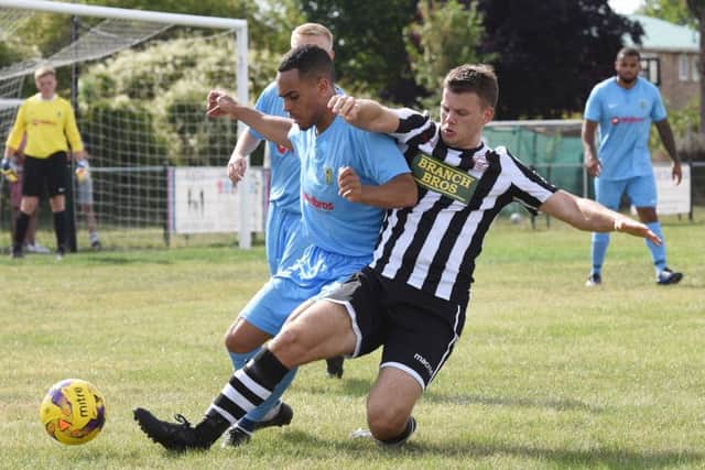 James Hill-Seekings (stripes) makes a tackle for Peterborough Northern Star against Rugby. Photo: Chantelle McDonal. @cmcdphotos