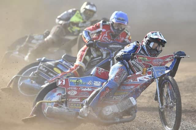 Heat four action in Peterborough Panthers' draw with Ipswich involving home rider Tom Bacon (blue). Photo: David Lowndes.