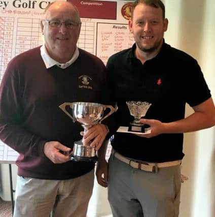 Ramsey club champion Martin Hollands (right) with club captain Terry Cripps.