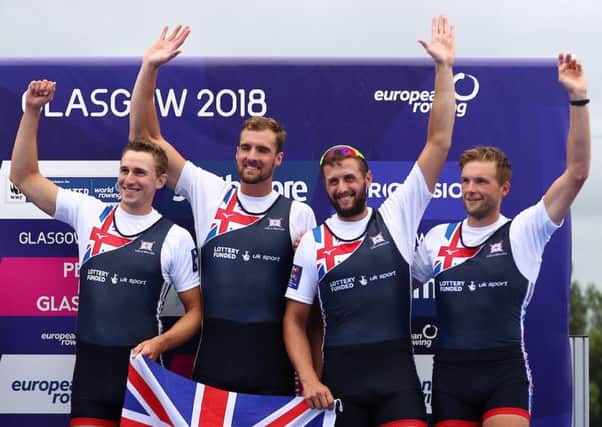 Adam Neill (second left) celebrates winning a silver medal at the European Championships. Picture: Naomi Baker