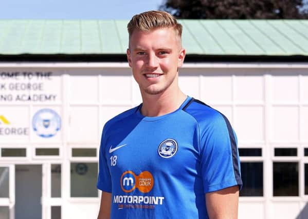 Adam King after signing for Posh.