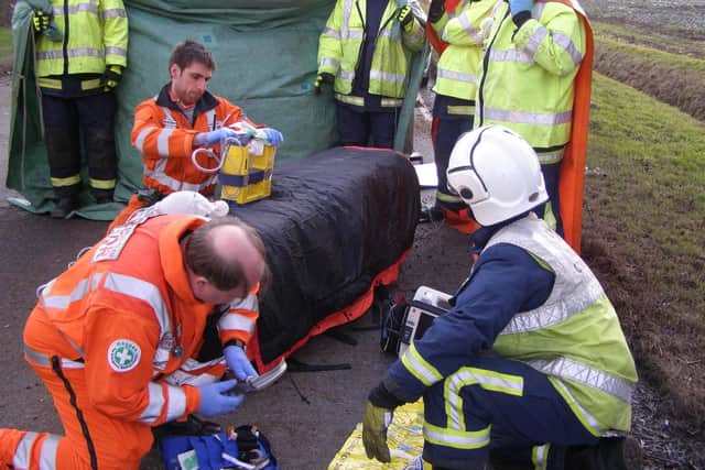 Dan Cody and Dr Peter Holden setting up to give enhanced medical care to a critically ill patient