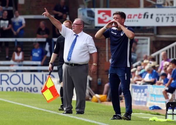 Steve Evans issues instructions from the touchline alongside Bristol Rovers manager Darrell Clarke. Picture: Joe Dent