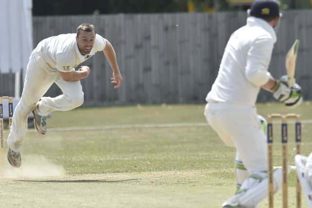 Jamie Smith bowling for Peterborough Town against Geddington. Photo: David Lowndes.